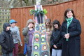 Some of the young carers with sculptor Victoria Ferrand-Scott and the totem pole.
