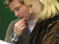 Image of students reading information at the Careers Fair
