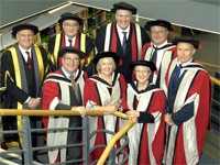 Back row: Chairman of the Governors, Sandy Anderson OBE, Chancellor Lord Sawyer, Vice-Chancellor Professor Graham Henderson, Eric Thomas , Alan Hinkes OBE. Front row: Steve Penrose , Margaret Fay OBE and Thelma Barlow.