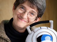Karen Prell with Wheatley, the exuberantly delusional sphere from the award-winning video game Portal 2. Karen Prell with Wheatley, the exuberantly delusional sphere from the award-winning video game Portal 2.