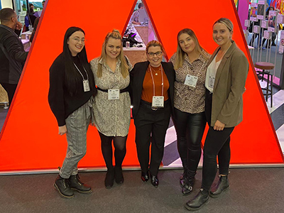 Principal lecturer Beverley Boden (centre) with the prize-winning students (from left) Billie-Jo Bowie, Abbie Waldby, Megan Maguire and Megan McCullow at the Bett Show.. Link to View the pictures.