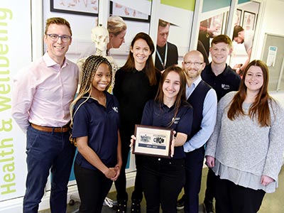 From left, Daniel Moore, student Emma Simpson, Faye Deane, student Kristina Saraci, clinic supervisor Ben Grant, student Aidan Heywood, and chiropractic lecturer Brittany Baggatt.. Link to View the pictures.
