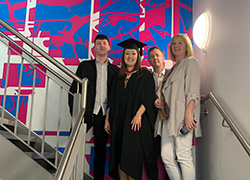 Emma Woodward (centre left) pictured with family next to her design.