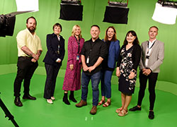 Representatives from Teesside University and Signpost Productions in the green screen studios at Teesside University