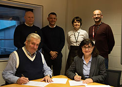 Back from left, Derek Booth, of The Wired Lobby; Michael Harvey, of Constantine Media; Siobhan Fenton and Darren Abbott, from the University’s School of Computing, Engineering & Digital Technologies. Front, Edwin Ford, of The Wired Lobby; Professor Chrisina Jayne, Dean of the University’s School of Computing, Engineering & Digital Technologies.