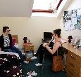 Two students sit in a bedroom at East Parkside Village Teesside University