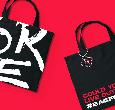 A bag for life in black with large white letters on it