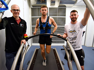 Dr Nicolas Berger with Michael Bleasby and Tom Walker in the environmental chamber. Link to University facilities prepare fundraisers for gruelling Gambian run.