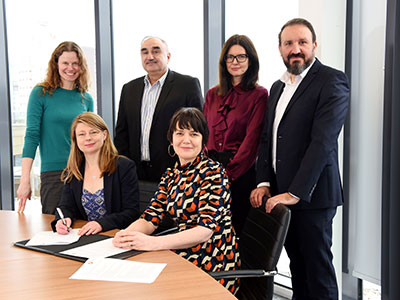 Siobhan Fenton and Kim Gauld-Clark signing the Memorandum of Understanding with staff from Teesside University and Sofia.. Link to Teesside University and Sofia Offshore Wind Farm sign strategic skills partnership.