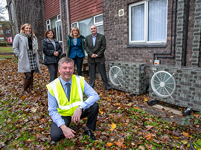 Front - Wes McGeeney, Renewables Manager, Thirteen. Back (L-R) - Jayne Lawson, Head of Innovation and Marketing, Thirteen, with Dr Huda Dawood, Professor Natasha Vall and Professor Nashwan Dawood from Teesside University at Oval Grange in Hartlepool where air source heatpumps are being installed in houses.. Link to Funding boost for green projects.