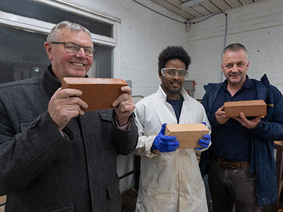 (L-R): Bob Borthwick, Feysal Shifa and Peter Scott with the prototype bricks. Link to  ‘Recycled’ brick attracts interest from national housebuilder.