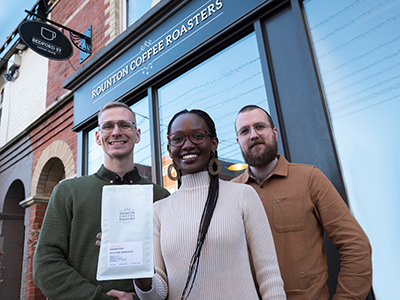 Bernice and her husband Luke with Tom Keavney, of Rounton. Link to Graduate brings Rwandan coffee to Middlesbrough café.