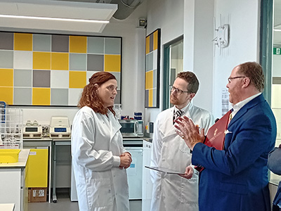 George Freeman MP (right), Minister for Science, Research and Innovation, speaking to Professor Linda Popplewell and Professor John S. Young at Teesside University’s National Horizons Centre. Link to Cutting-edge bioscience facility showcased to Minister.