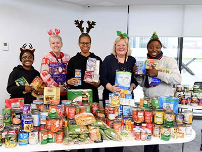Teesside University volunteers with some of the donated food collected as part of the Festive Food Drive