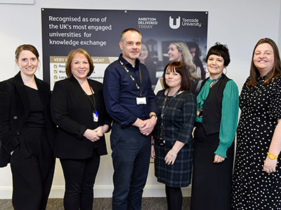 Professor Craig Gaskell (centre), Pro Vice-Chancellor (Enterprise and Knowledge Exchange), with the University’s Associate Deans for Enterprise and Knowledge Exchange, (from left) Charlotte Nichol, Ruth Mitchell, Dr Helen Dudiak, Siobhan Fenton and Professor Vikki Rand (Director of the National Horizons Centre).. Link to University’s support for business recognised with national accreditation.