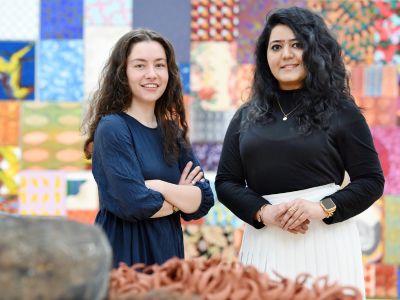 Caitlin McHugh (left) and Faiza Faiq (right). Link to Curatorial studies culminating with international art exhibition.