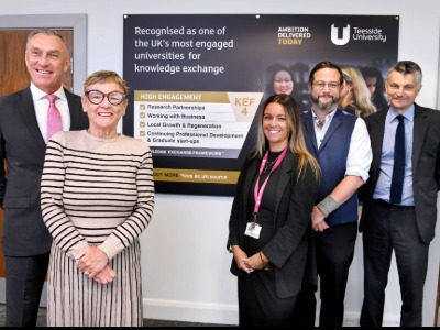 Teesside University Vice-Chancellor Professor Paul Croney OBE (far-left) and Pro Vice-Chancellor (Research and Knowledge Exchange) Professor Stephen Cummings (far-right) with the University's  METIUS team. Link to Teesside University to help deliver £11.5m AI-driven project to transform global policymaking .