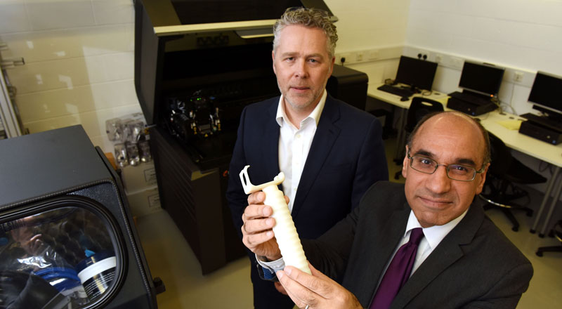 Professor Andrew Owens (left) and Professor Zulf Ali with the prototype handle.