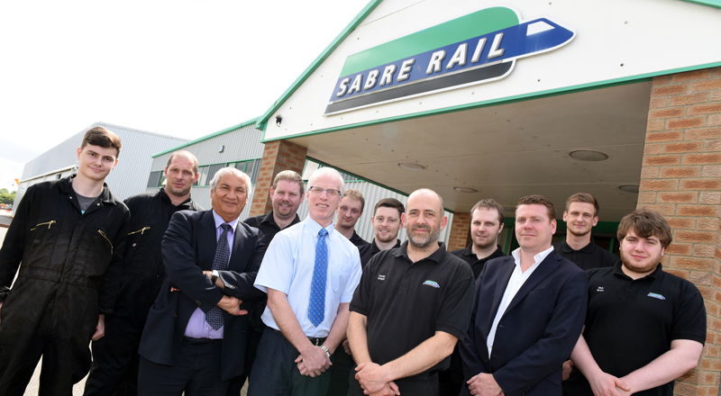 Professor Farhad Nabhani (third from left) with Sabre Rail Operations Manager Brian Capeling (fifth from left) and chief executive Stephen Thompson (third from right), along with members of staff who have completed, or are working on, qualifications at Teesside University.