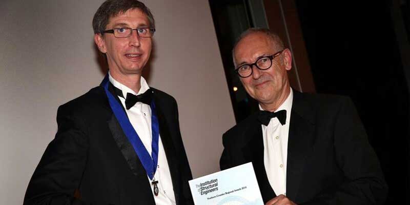 Doug Kay (left) Chairman of the Institution of Structural Engineers Northern Regions Committee, presenting the award to Barry Walmsley (right).