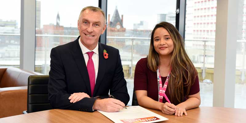 Vice-Chancellor and Chief Executive of Teesside University Professor Paul Croney signs the All Different, All Equal pledge with the President of the Students' Union Bruna Silva. 