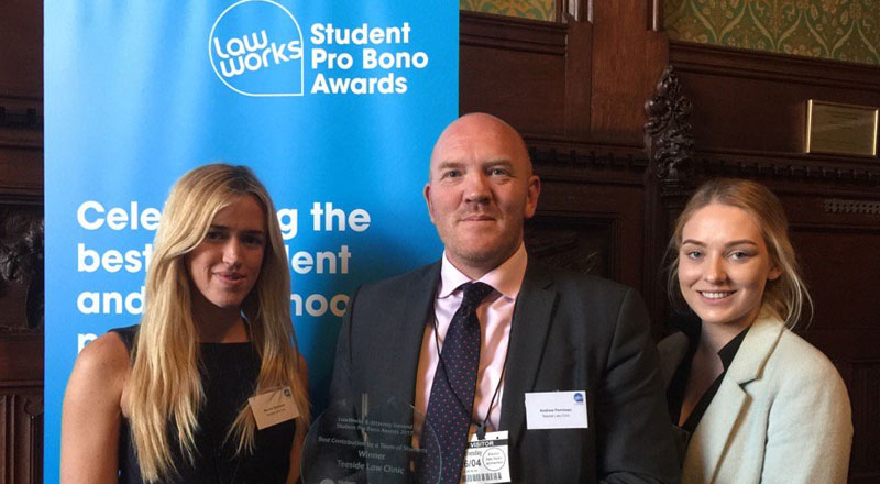 Teesside Law Clinic students, Rachel Simmons, right, Kendal Iley, left, with Andrew Perriman, Senior Law Lecturer, receiving their award at the House of Commons.