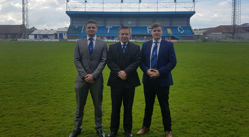 Liam Brown, Mike Edwards, Marketing Director at Whitby Town FC, and James McDonald.