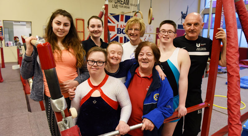 Teesside University students Leah Gibbs (back row, second left) and Kevin Gamblin (far right) with coaches and members of the Gym World Special Needs Gymnastic Team.