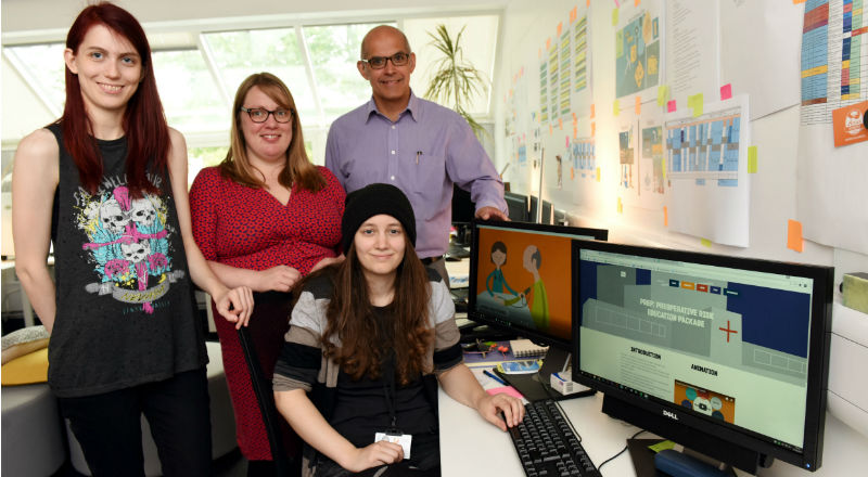 From left: Kayleigh Stevens (BA(Hons) Computer Games Animation graduate); Eleanor Land (Senior Lecturer, School of Computing); Gerard Danjoux (Consultant in Anaesthesia) and (seated) Zoe Llewellyn (BA(Hons) Computer Character Animation graduate)