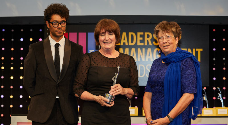 Director of Academic Enterprise Laura Woods (centre) with THELMAs host comedian Richard Ayoade (left) and Lesley Thompson, Vice-President Academic Relations at award sponsors Elsevier.
