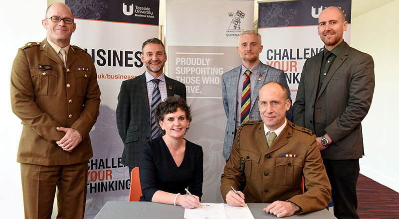 Pro Vice-Chancellor (Enterprise and Business Engagement) Professor Jane Turner OBE DL signing the Armed Forces Covenant with Lt Col Nathan Teale, Task Forces Commander Durham and Tees Valley. Alongside are (back from left) Lt Col Andy Black, Senior Engagement Officer; Gary McLafferty, North-East Director of Engagement; Darren Rhodes, Regional Employer Engagement Director; Dr David Norris, Associate Dean, Teesside University Business School.