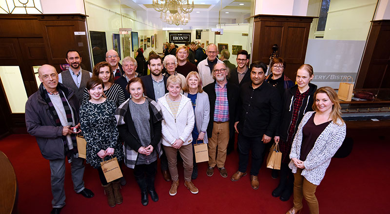 Julie Macbean, pictured centre, with other graduates exhibiting their work.