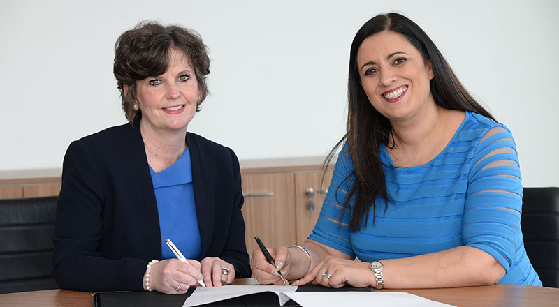 Professor Jane Turner OBE DL (left) signing the agreement with Brenda McLeish.