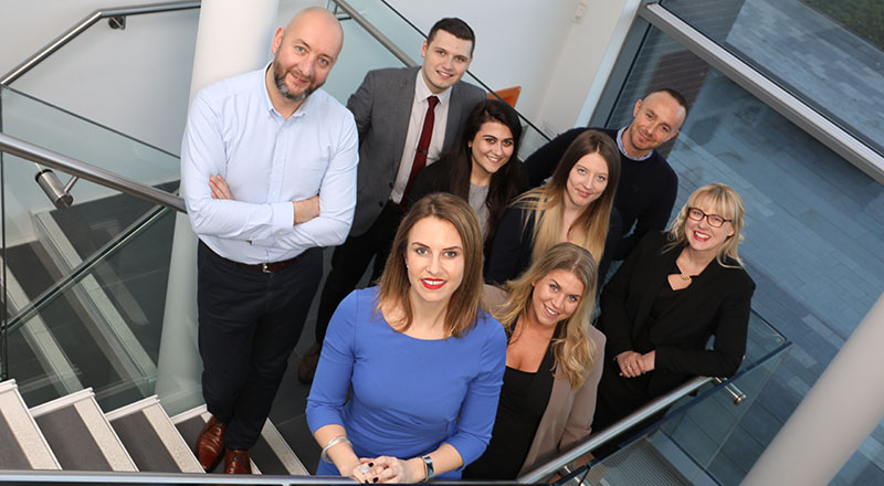 Jessica Williams, (foreground) managing director, Just Williams, with her growing team (left to right) Marc Atkinson, Joseph Kelly, Jasmine Ashley, Lucy Tyreman, Chris Garbutt, Erica Legg and Anna Caygill. 