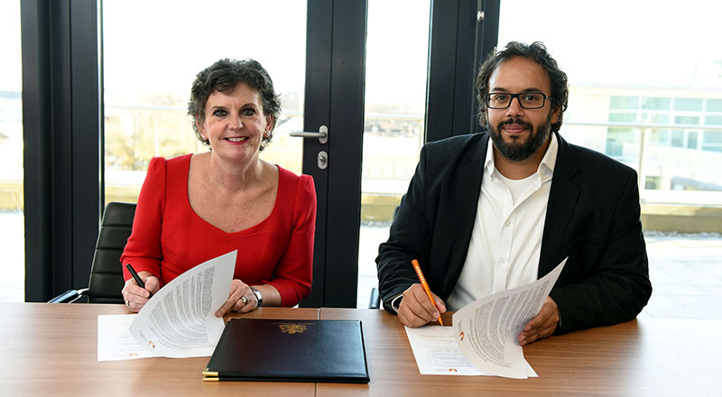 Pro Vice-Chancellor (Enterprise and Business Engagement) Professor Jane Turner OBE DL signing the memorandum of understanding with Mark South, Chief Operating Officer at Double Eleven.