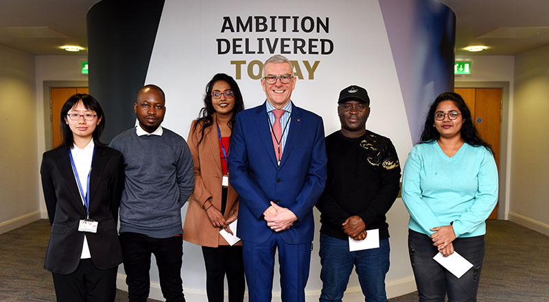 Dr David Bell with some of the winners of the International Student Barometer prize draw.