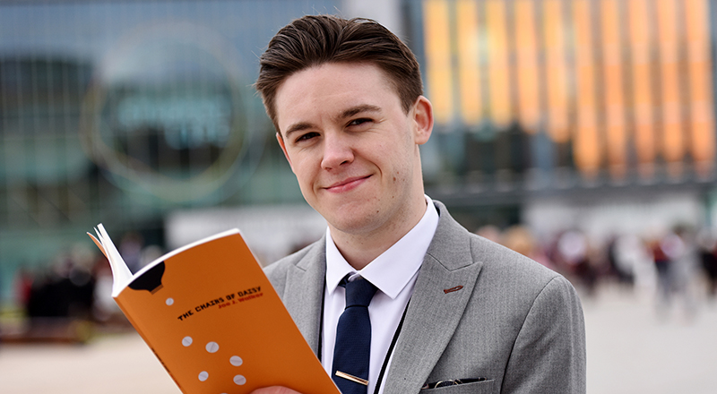 Joe J Walker pictured with his book