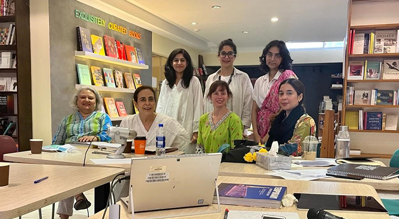Editing Women participants at The Last Word bookshop, Lahore. (Left to right) Front row - Niilofur Farrukh, Mehvash Amin, Madeline Clements and Afshan Shafi; Back row - Maham Khan, Mina Malik, and Emil Hasnain.