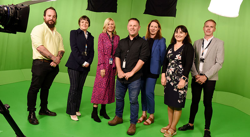 Representatives from Teesside University and Signpost Productions in the green screen studios at Teesside University