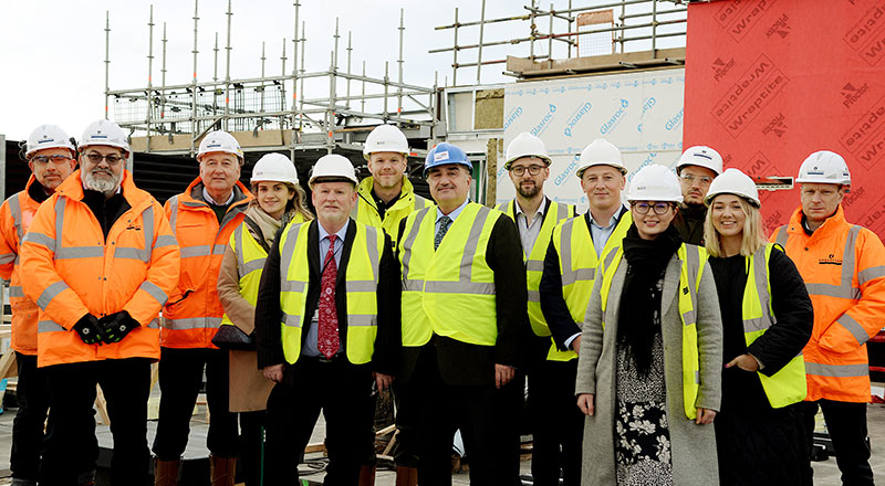 Members of staff from Teesside University, Robertson Construction and GSSArchitecture celebrate a major milestone in the NZIIC development.