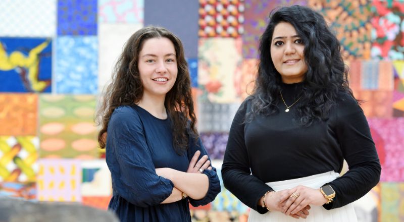 Caitlin McHugh (left) and Faiza Faiq (right). Link to Curatorial studies culminating with international art exhibition.