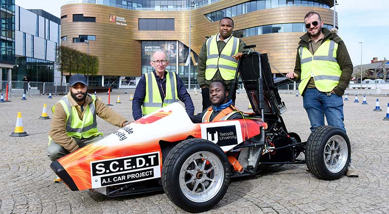 Pictured in the car is student Oluwafemi Akhigbe, with (left to right) student Kenny Omoworare, and academics from the School of Computing, Engineering and Digital Technologies, Alex Ellin, Chris Ogwumike and Hayder Hammood.
