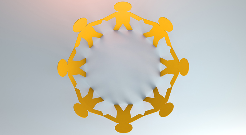 3D illustration of silhouette of people united as yellow paper cut out and holding hands in a circle.