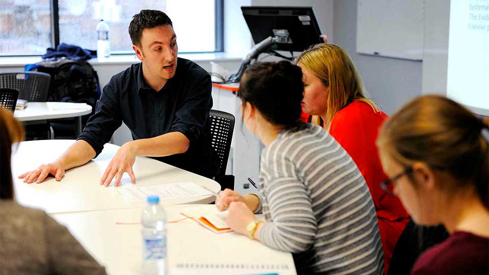 Staff talking in a training session