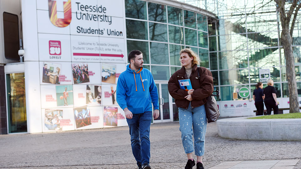 Students in front of Students' Union building
