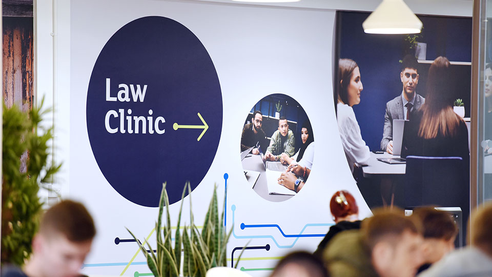 Wall sign for Teesside University Law Clinic on first floor of Themis Building