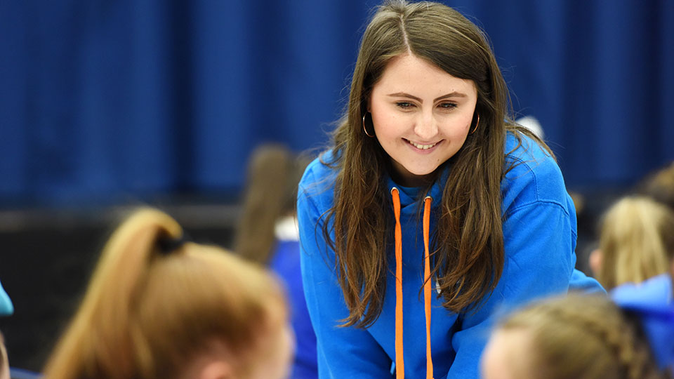University ambassador mentoring students at a university campus event