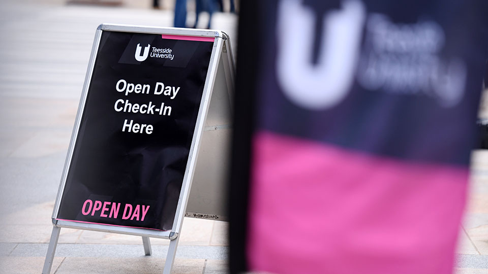 Teesside University open day welcome sign reading 'Open Day Check-In Here'