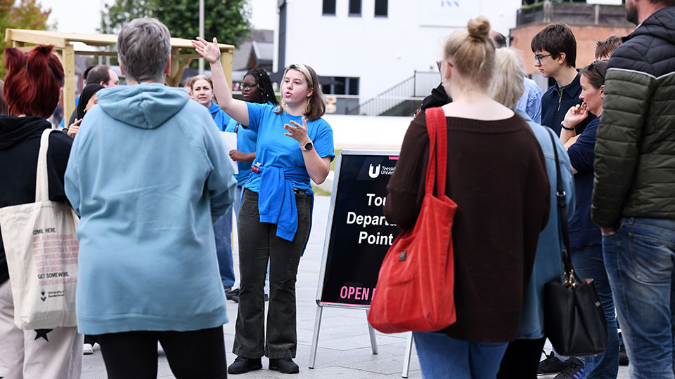 University ambassador guiding prospective students during a campus visit