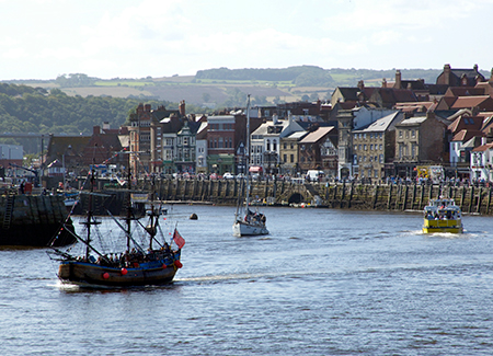 Seaside at WHitby with some boats and buildings landscape
